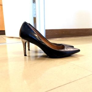 Black Calvin Klein pointy-toed pumps, size 8